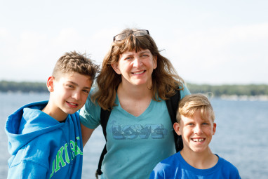 Mom and the boys posing by Lake Okoboji